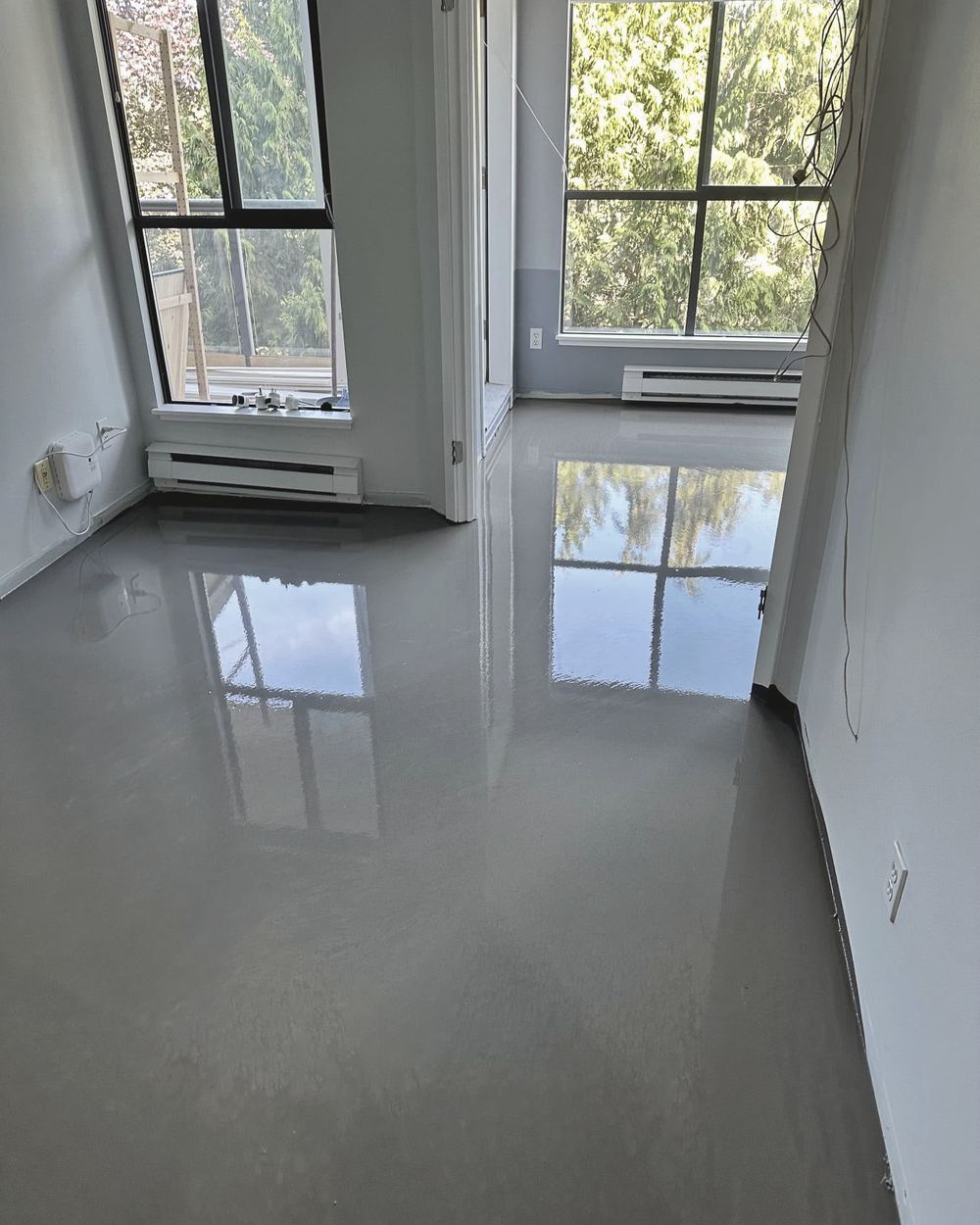 New epoxy floor in a bright Maple Ridge room
